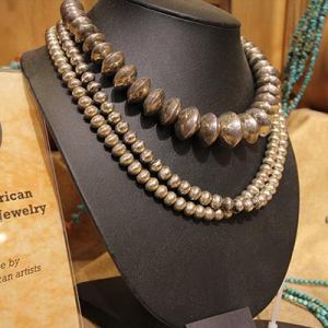 Three necklaces on display at White Sands Trading Company